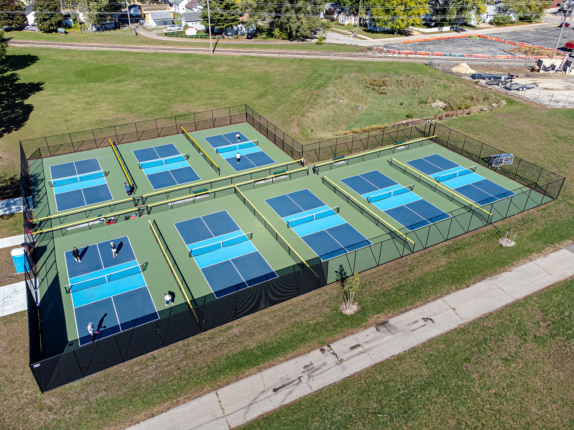 A marked pickleball court with net